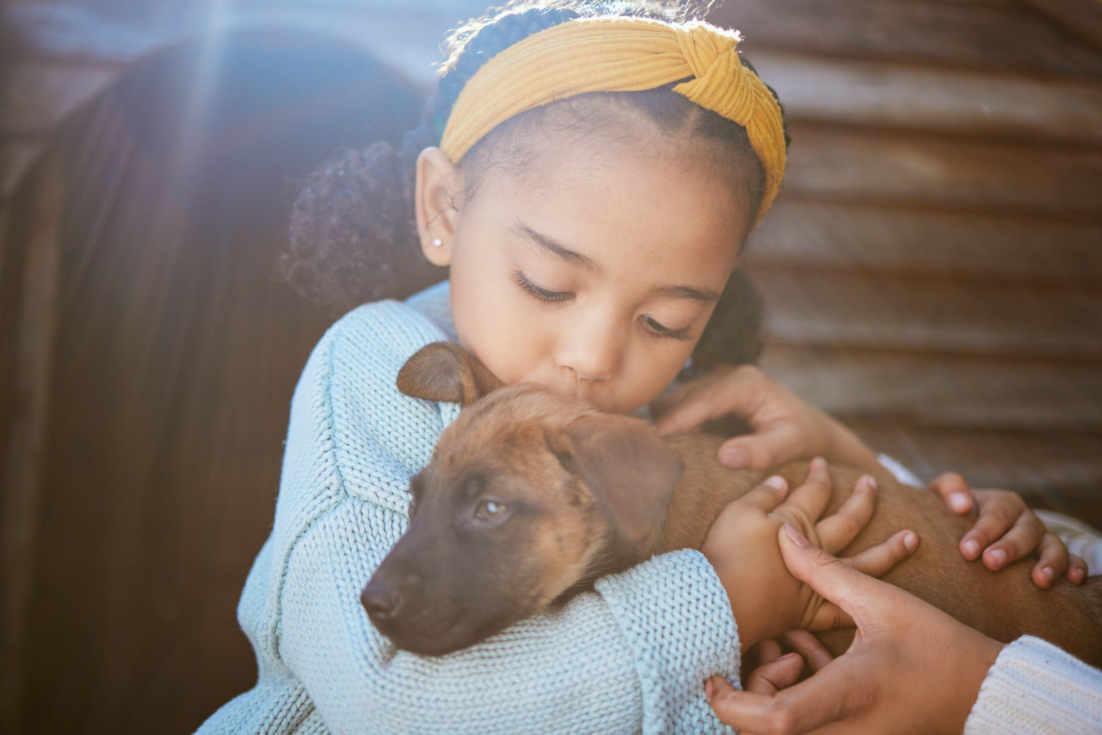 young girl with new puppy